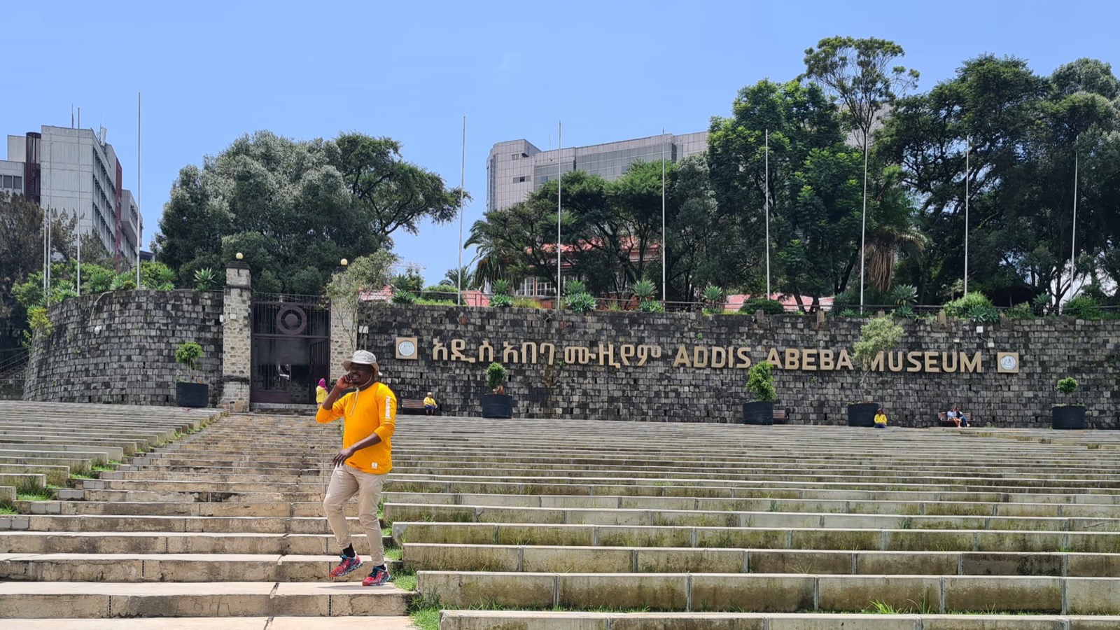 A visitor on the steps of the Addis Abeba Museum, Ethiopia