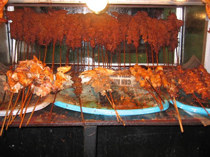 Skewers of Nigerian suya coated in yaji spice
